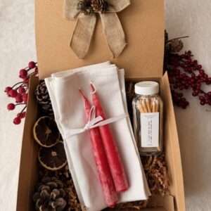 gift set with linen napkins, red candles and matches